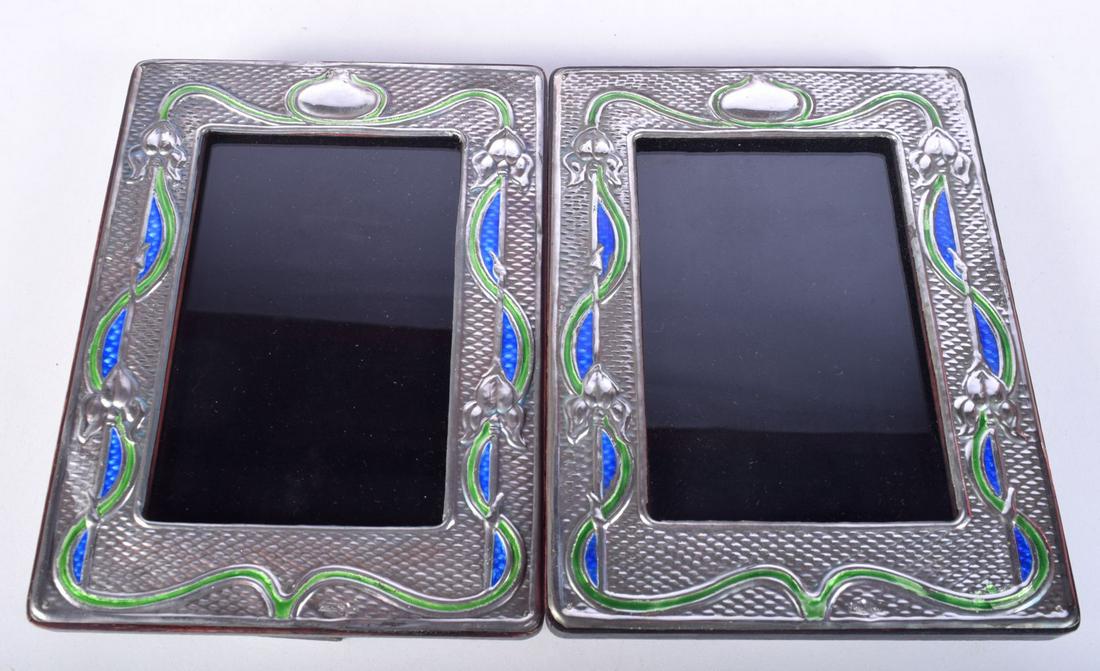 A PAIR OF STERLING SILVER AND ENAMEL PHOTO FRAMES.  Stamped Sterling, Frame 19.5cm x 14.5cm, (2) (1 of 3)