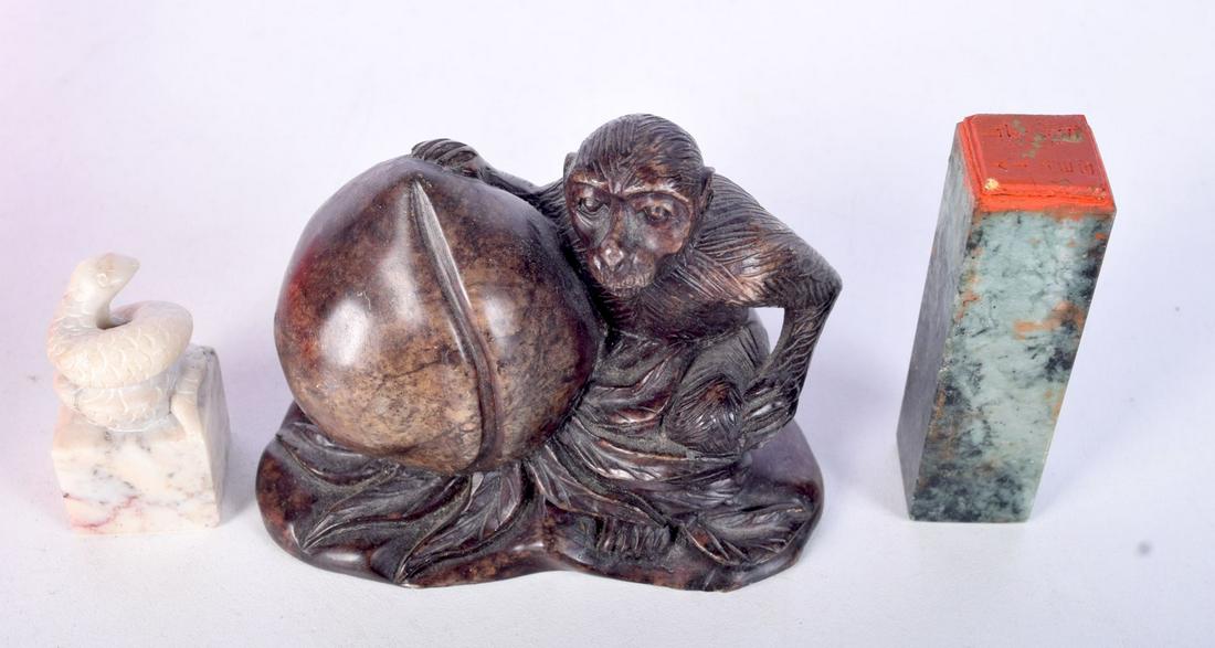A CARVED SOAPSTONE MONKEY HOLDING A GOURD TOGETHER WITH TWO CARVED SEALS. (3): A CARVED SOAPSTONE MONKEY HOLDING A GOURD TOGETHER WITH TWO CARVED SEALS. (3)