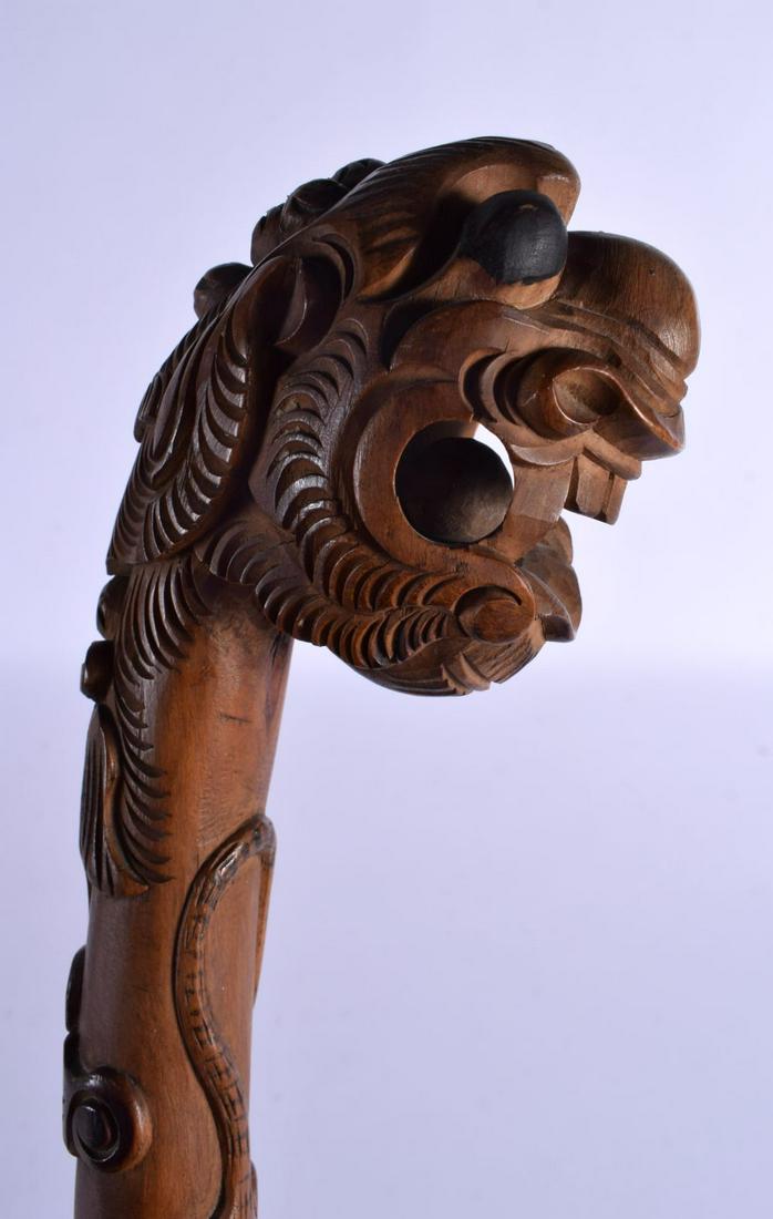 AN EARLY 20TH CENTURY SOUTH EAST ASIAN CARVED WOOD DRAGON WALKING CANE smothered in motifs. 85 cm lo (1 of 4)