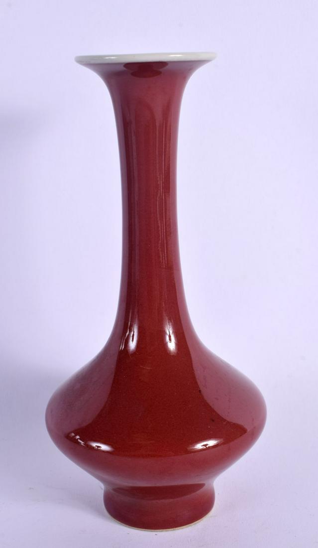 A CHINESE RED GLAZE FLAMBE GLAZED VASE of bulbous form. 17 cm high. (1 of 4)