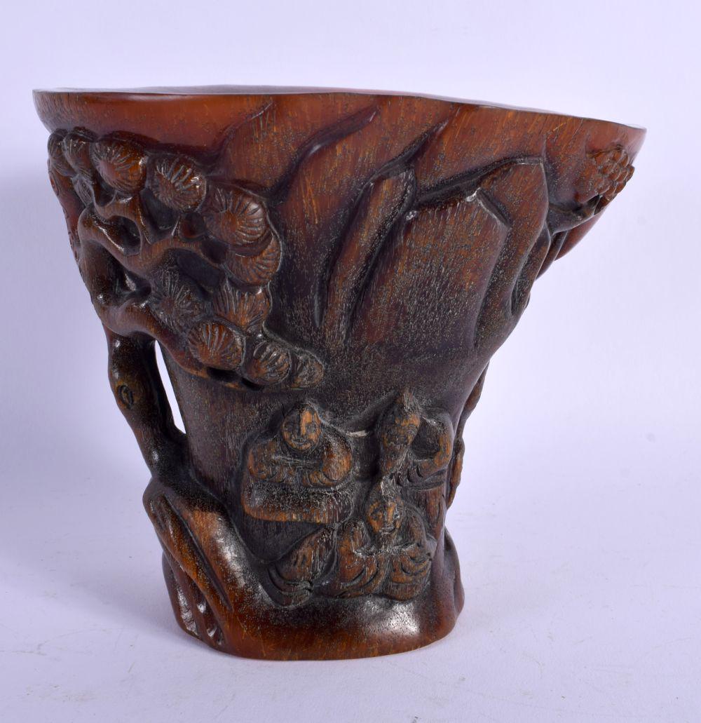 A LARGE CHINESE CARVED BUFFALO HORN TYPE LIBATION CUP of naturalistic form. 14 cm x 13 cm. (1 of 4)