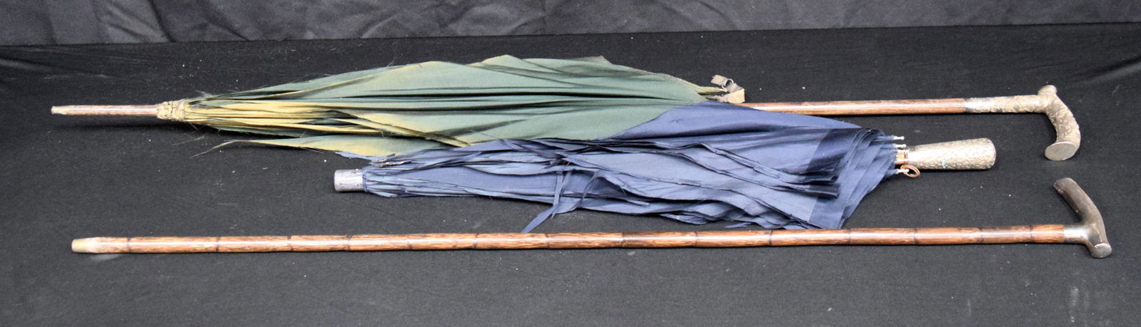 A silver handled wooden umbrella together with a  parasol and a silver handled walking cane longest (1 of 6)