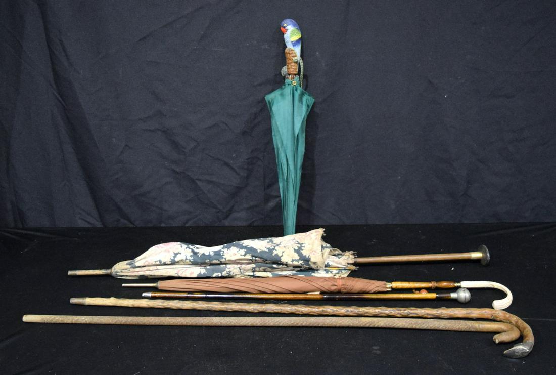 A collection of antique and vintage parasols, together with two walking canes. Longest 85cm (6). (1 of 5)