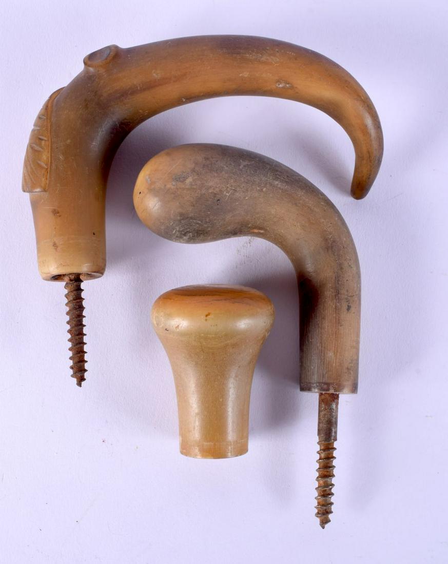 THREE 19TH CENTURY MIDDLE EASTERN CARVED RHINOCEROS HORN WALKING CANE HANDLES. 205 grams. 10.5 cm x (1 of 2)