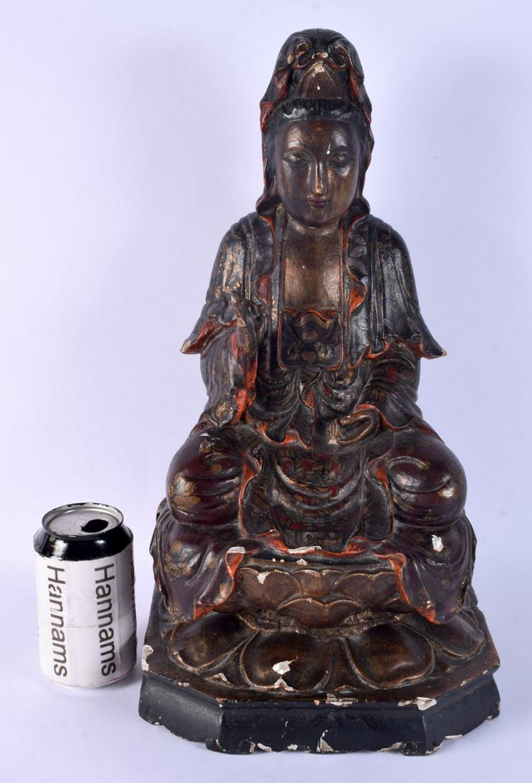 A LARGE 18TH CENTURY CHINESE POLYCHROMED WOOD FIGURE OF GUANYIN modelled with one hand raised, paint: A LARGE 18TH CENTURY CHINESE POLYCHROMED WOOD FIGURE OF GUANYIN modelled with one hand raised, painted with floral sprays. 44 cm x 17 cm. Note: See a similar gilt representation of this figure, Lot 17