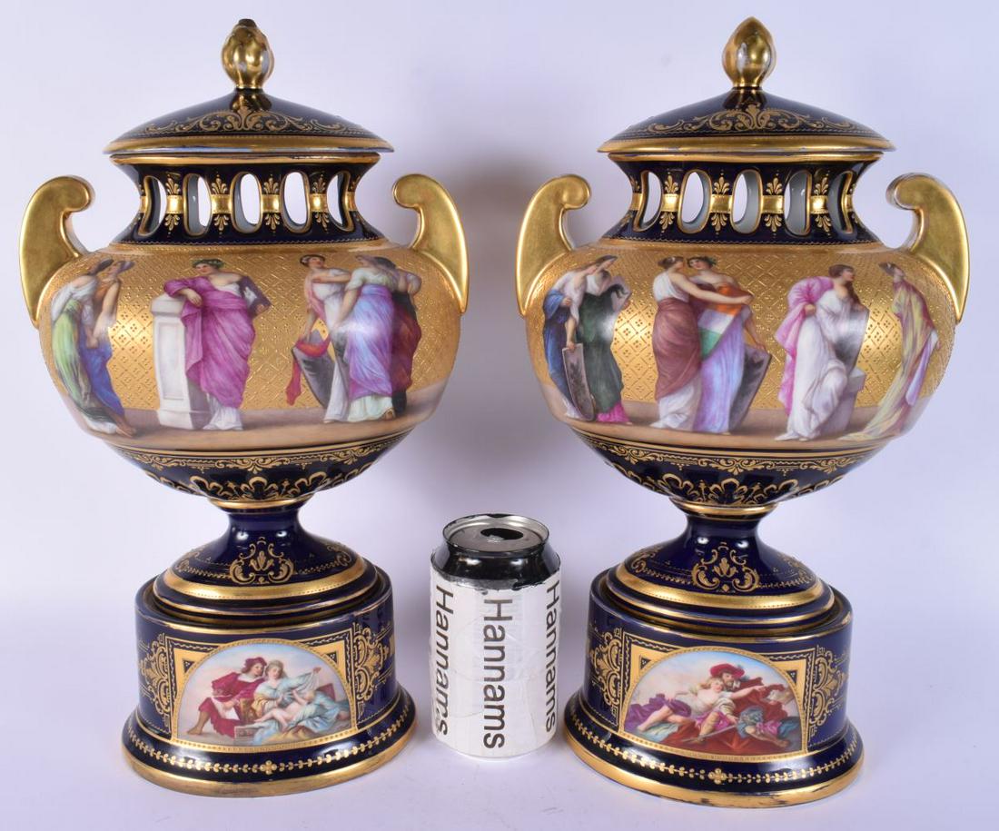 A LARGE PAIR OF VIENNA TWIN HANDLED PORCELAIN VASES AND COVERS painted with figures upon a blue grou (1 of 8)
