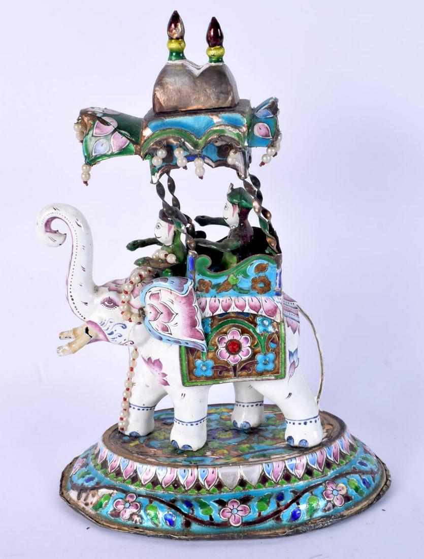 AN EARLY 20TH CENTURY INDIAN SILVER AND ENAMEL MODEL OF AN ELEPHANT modelled with attendants. 1245 g (1 of 5)