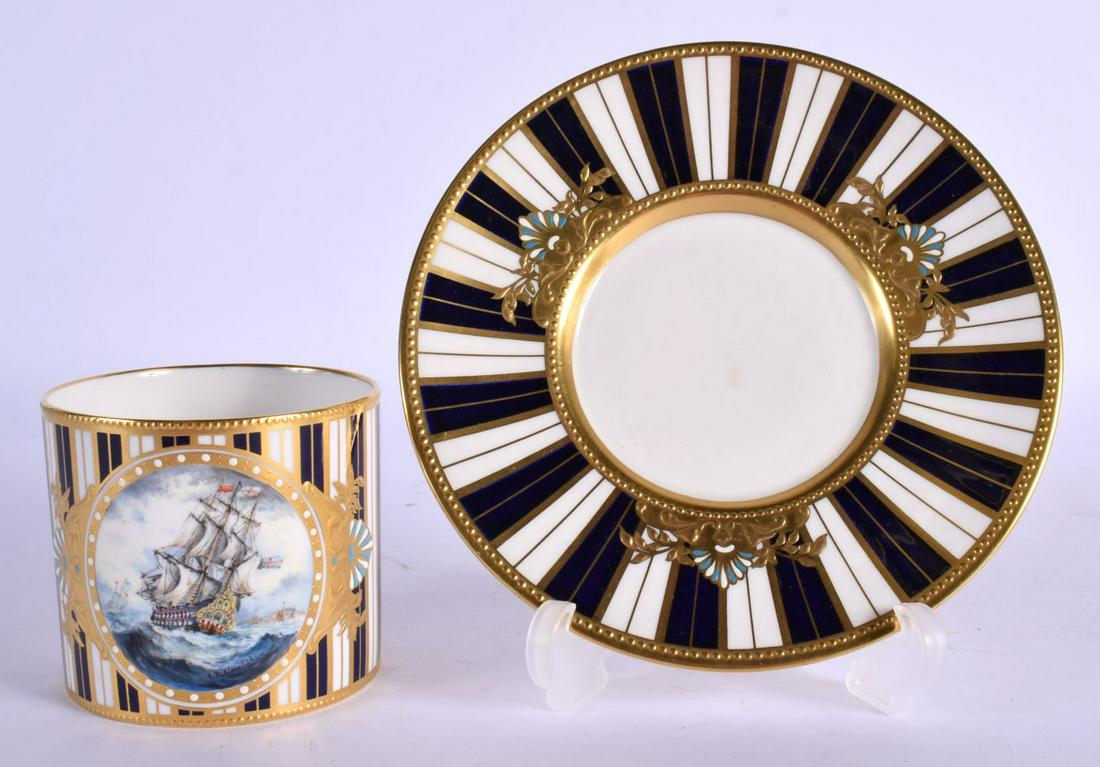 Lynton Porcelain (Derby) 'jewelled' coffee can and saucer by Stefan Nowacki, signed,: painted with a: Lynton Porcelain (Derby) 'jewelled' coffee can and saucer by Stefan Nowacki, signed,: painted with a harbour scene on a cobalt blue and gilt striped ground, gilt factory marks with painter's monogram 
