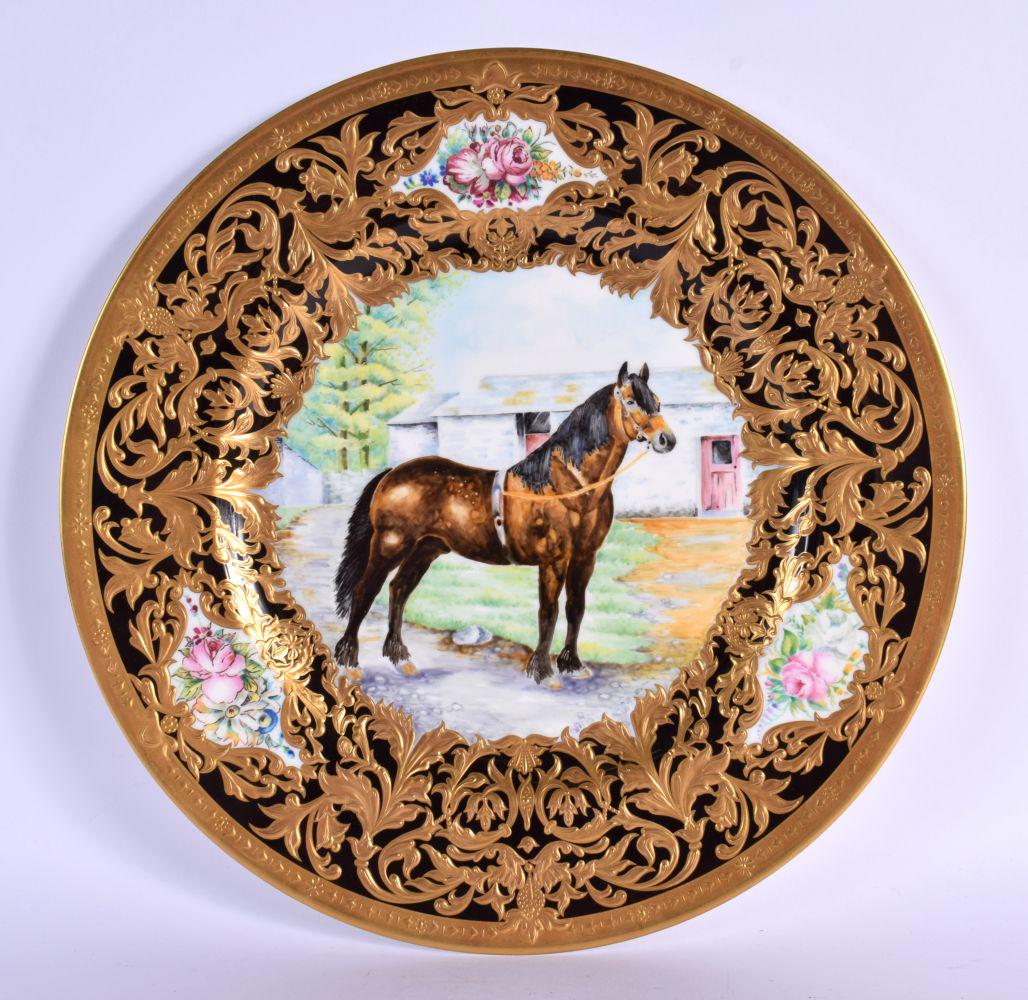 Lynton Porcelain cabinet plate decorated with a racehorse standing beside a stable block, with a hea (1 of 2)