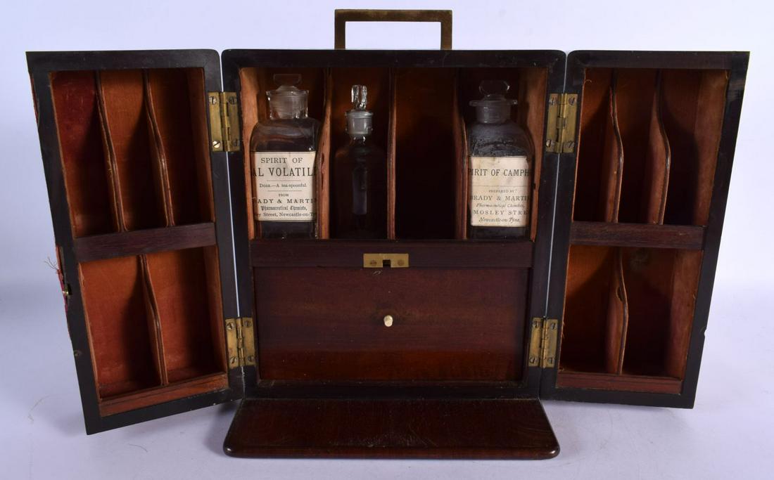 AN EARLY VICTORIAN MAHOGANY APOTHECARY CASED SET the doors opening to reveal bottles. 24 cm x 18 cm. (1 of 11)