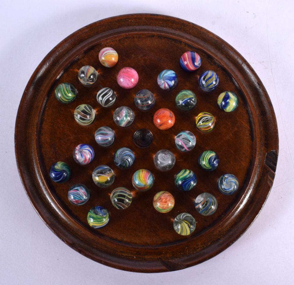 A SOLITAIRE MARBLE BOARD with marbles. Board 15 cm diameter. (qty) (1 of 3)