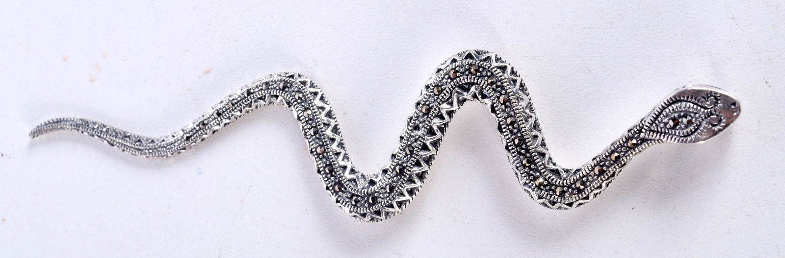 A SILVER SNAKE PENDANT.  Stamped 925, 12.5cm x 2.7cm, weight 11.4g (1 of 3)