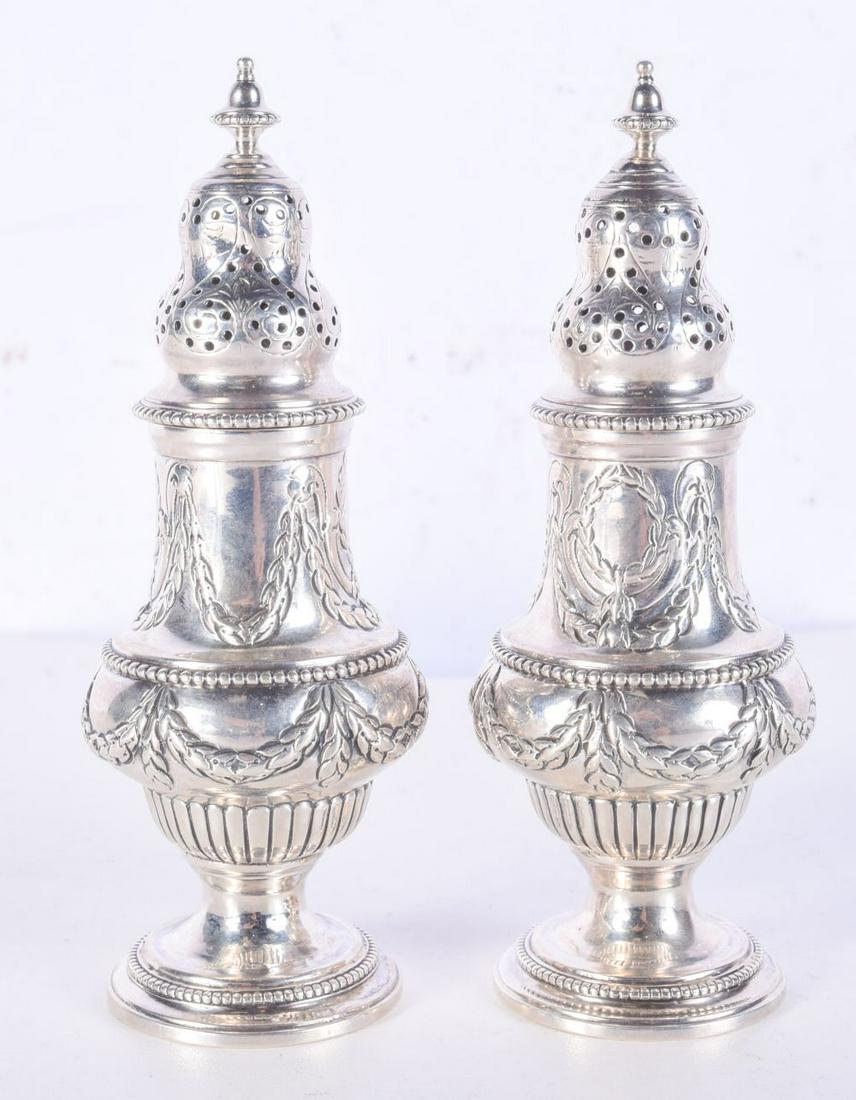A PAIR OF SILVER SIFTERS BY CHARLES STUART HARRIS. Hallmarked London 1896, 14cm x 5cm, weight 225g: A PAIR OF SILVER SIFTERS BY CHARLES STUART HARRIS. Hallmarked London 1896, 14cm x 5cm, weight 225g total