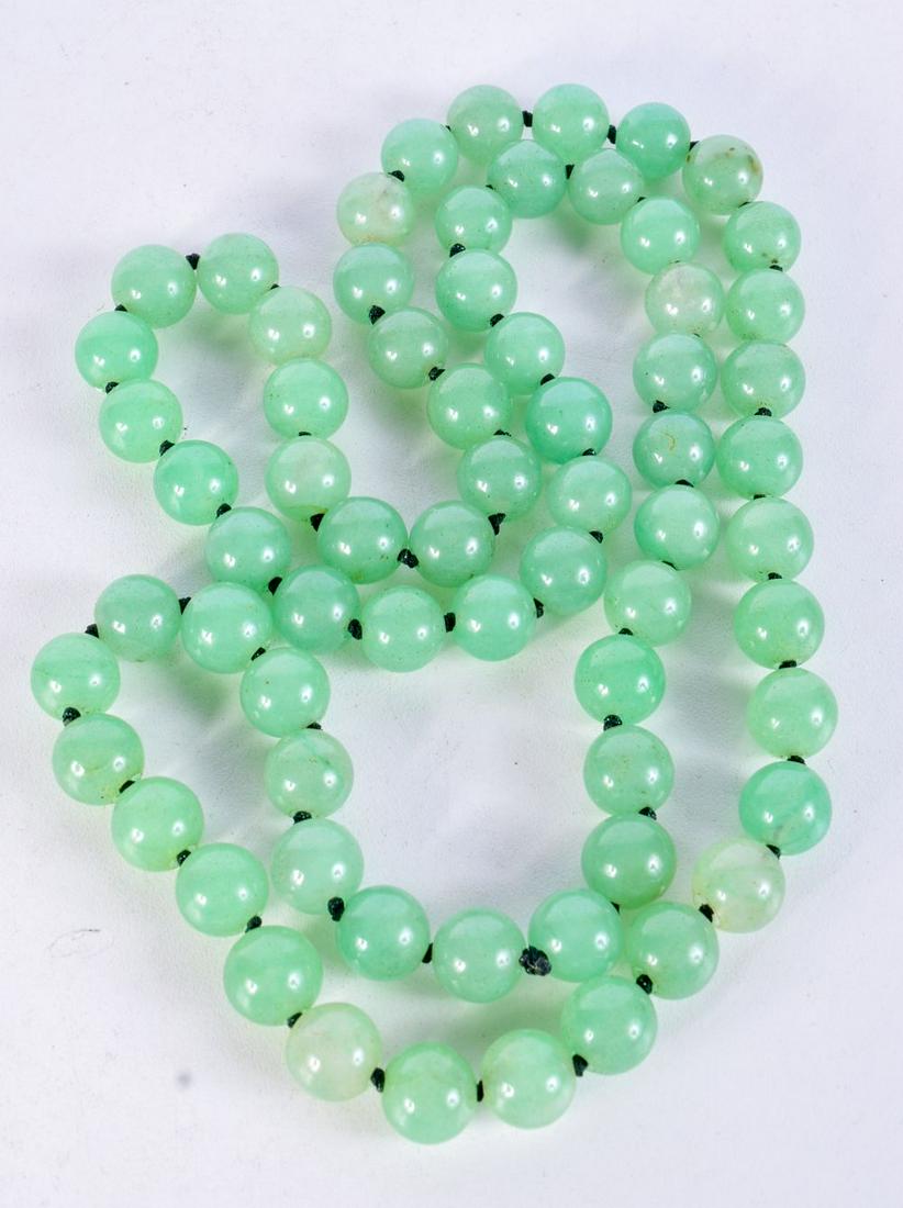 A STRING OF JADE TYPE BEADS.  Length 84cm, bead size 11.6mm, weight 159g (1 of 3)