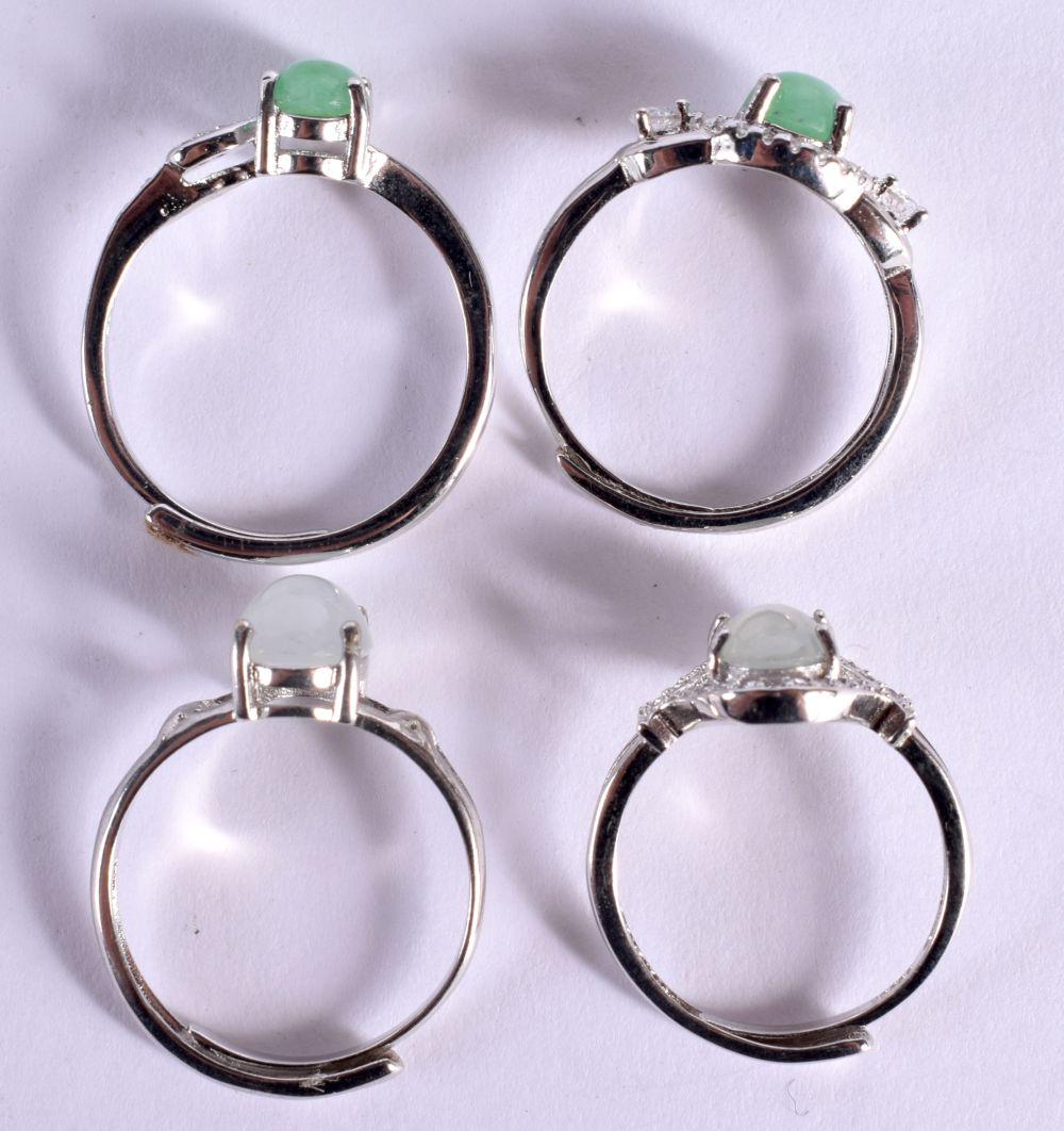 FOUR SILVER AND JADE RINGS. 6.6 grams. K to O. (4) (1 of 5)