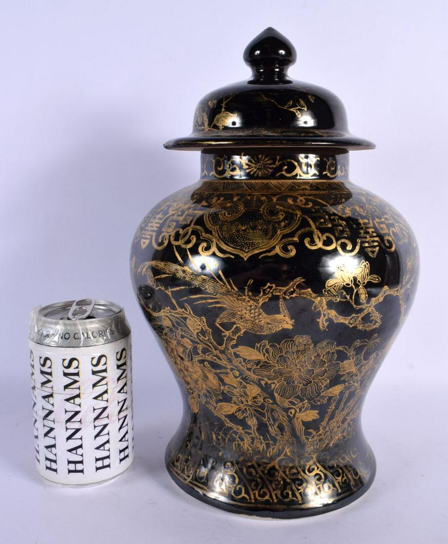 A RARE 19TH CENTURY CHINESE BLACK GLAZED VASE AND COVER Qing, gilded with foliage. 30 cm x 14 cm. (1 of 4)