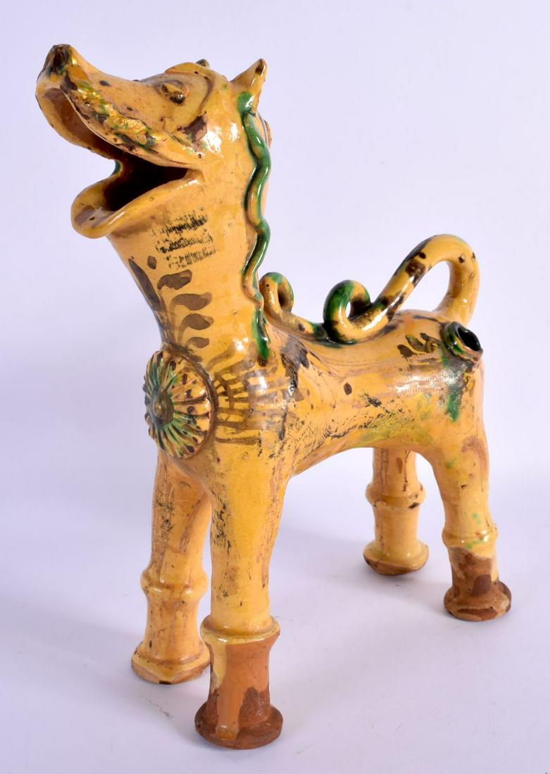 A TURKISH CANAKKALE POTTERY FIGURE OF A LION painted with motifs. 20 cm x 26 cm. (1 of 5)