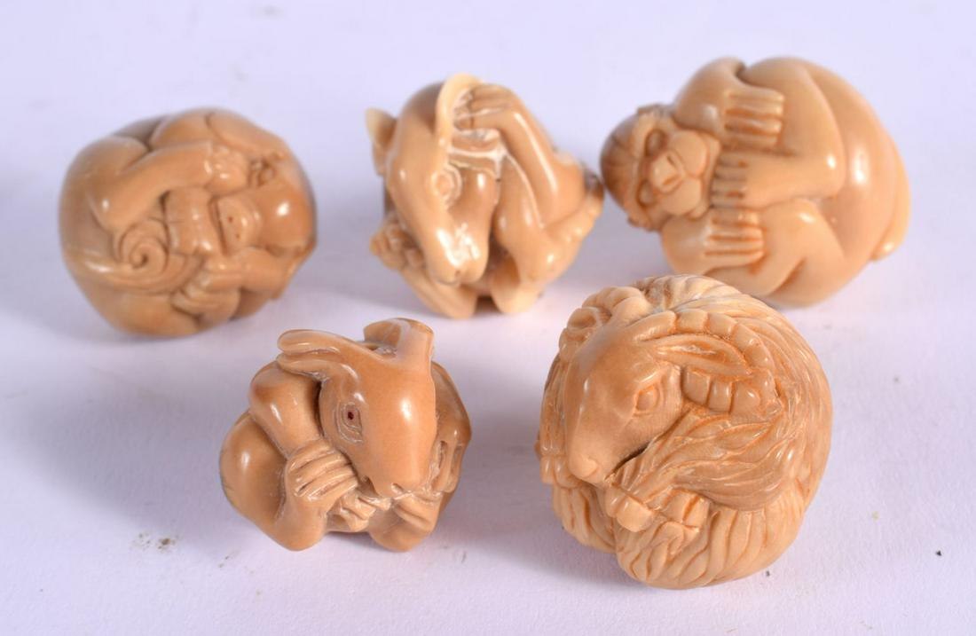 FIVE JAPANESE TAGUA NUT NETSUKES. 3.5 cm x 2.75 cm. (5) (1 of 2)