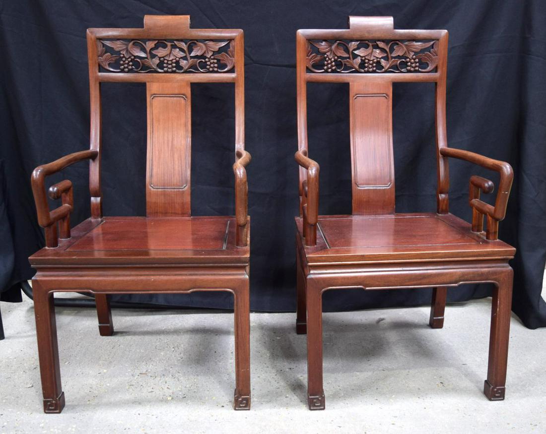 A pair of Early Chinese rosewood chairs with grapevine back panels 102cm by 54cm by 55cm: A pair of Early Chinese rosewood chairs with grapevine back panels 102cm by 54cm by 55cm