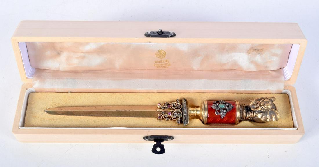 A CONTINENTAL SILVER AND ENAMEL JEWELLED ELEPHANT PAPER KNIFE. 126 grams. 20 cm x 2.75 cm. (1 of 8)