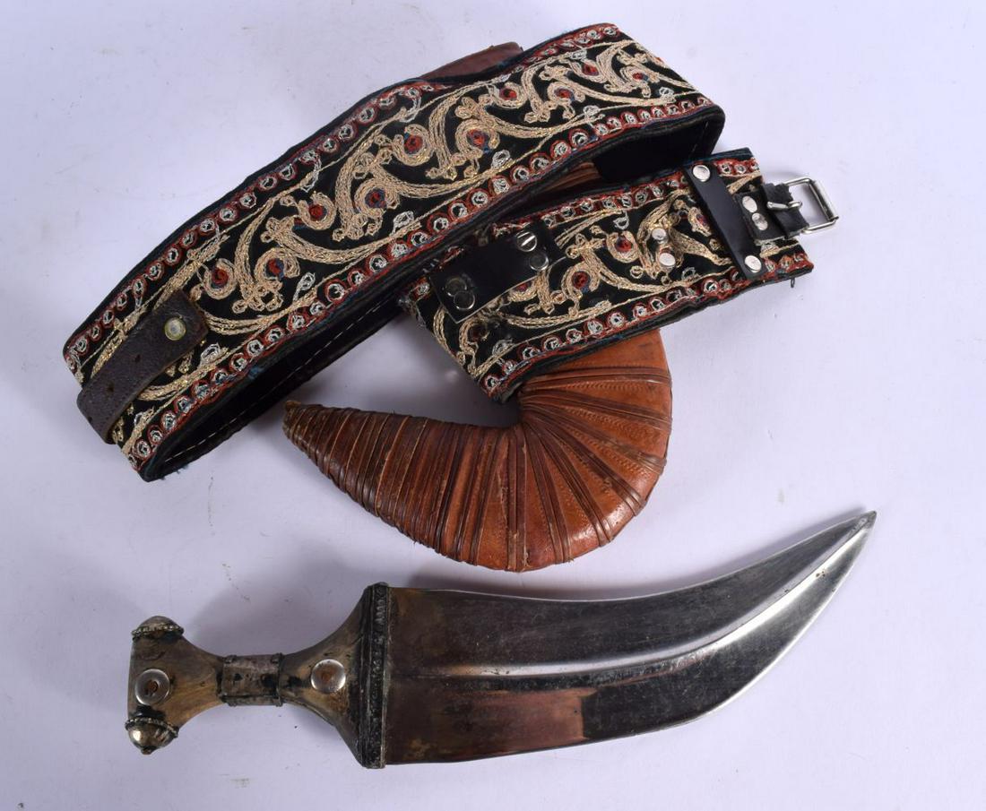 AN ANTIQUE MIDDLE EASTERN CARVED RHINOCEROS HORN OMANI JAMBIYA DAGGER with wire work mounts. Dagger (1 of 4)