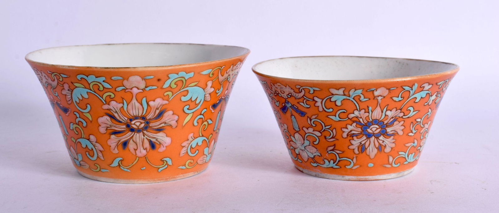 A RARE NEAR PAIR OF 19TH CENTURY CHINESE CORAL GROUND BOWLS Late Qing. Largest 9.5 cm diameter. (2) (1 of 4)