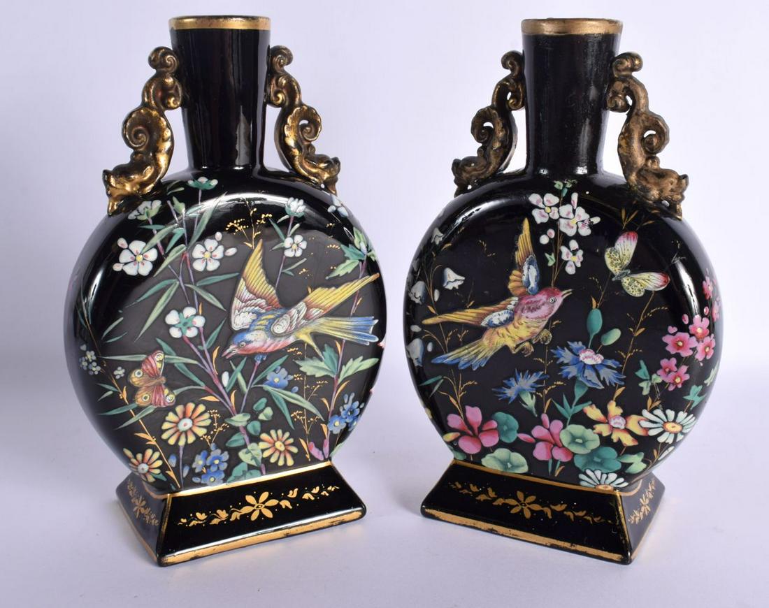 A PAIR OF 19TH CENTURY ENGLISH AESTHETIC MOVEMENT POTTERY MOON FLASKS Attributed to Ridgways. 23 cm: A PAIR OF 19TH CENTURY ENGLISH AESTHETIC MOVEMENT POTTERY MOON FLASKS Attributed to Ridgways. 23 cm x 11 cm.