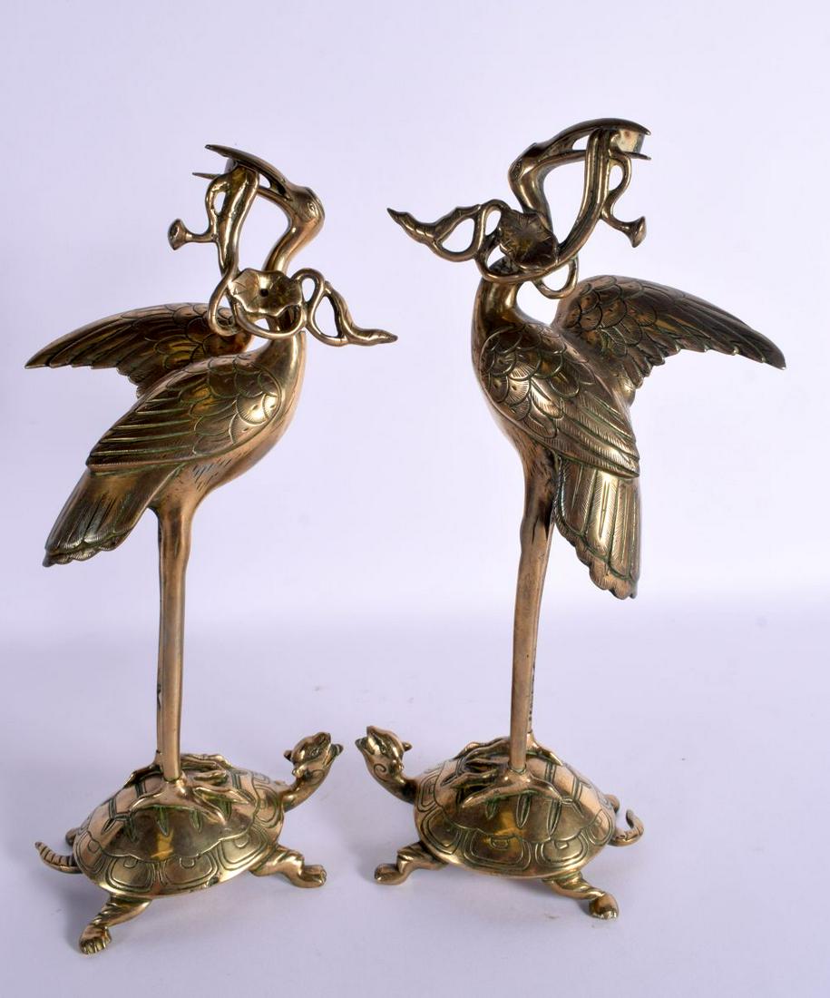 A PAIR OF 19TH CENTURY JAPANESE MEIJI PERIOD POLISHED BRONZE CANDLESTICKS formed as birds. 30 cm hig (1 of 3)