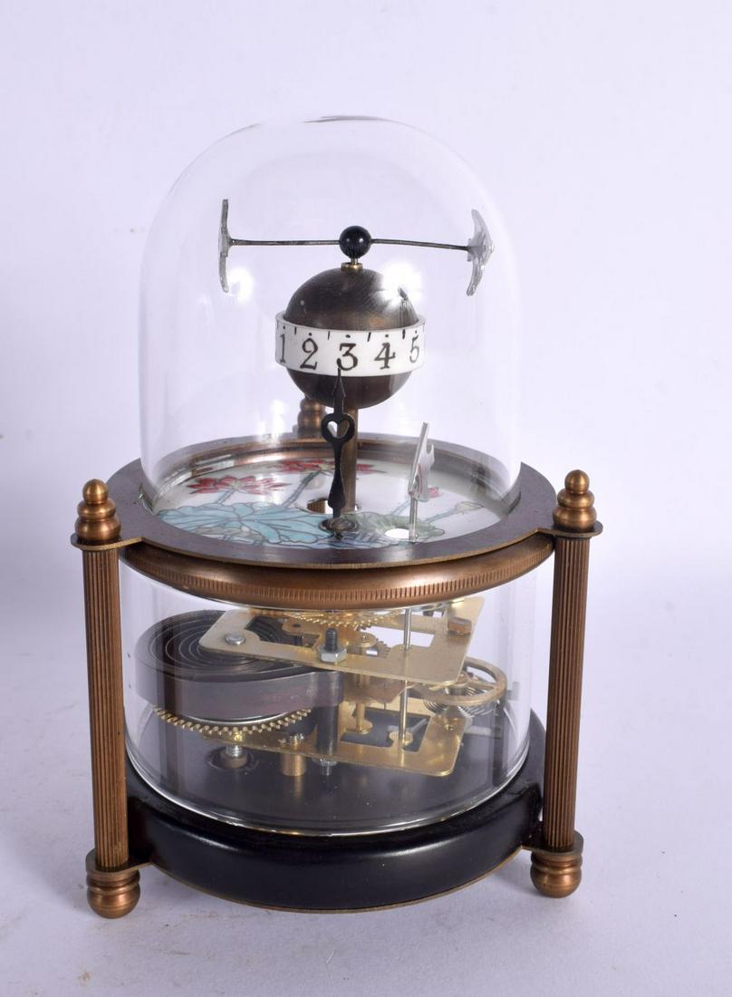 A CONTEMPORARY ROTATING FISH CLOCK. 15 cm high.: A CONTEMPORARY ROTATING FISH CLOCK. 15 cm high.