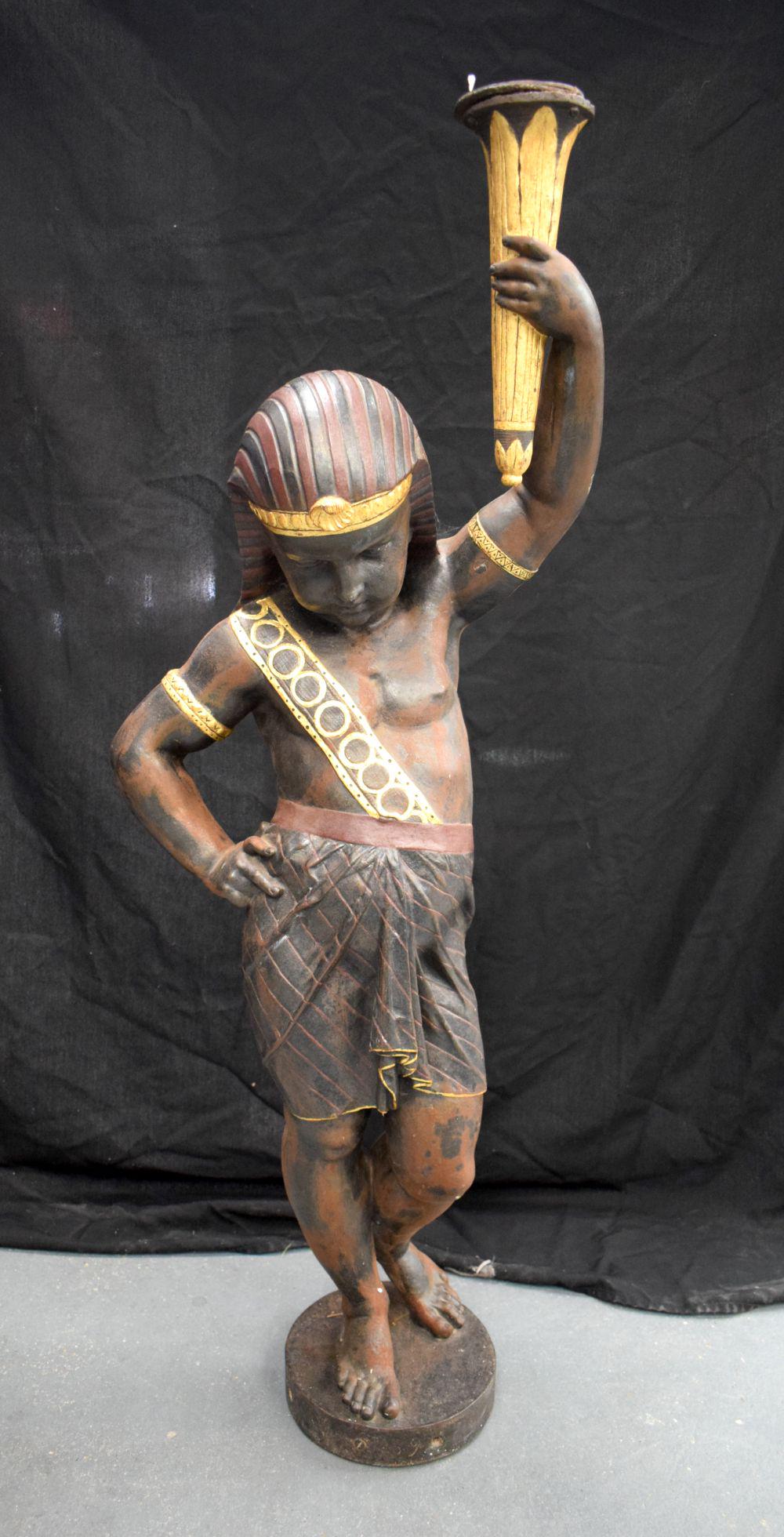 A LARGE EARLY 20TH CENTURY EUROPEAN CAST IRON FIGURE OF A BOY modelled in the Egyptian manner, with (1 of 9)