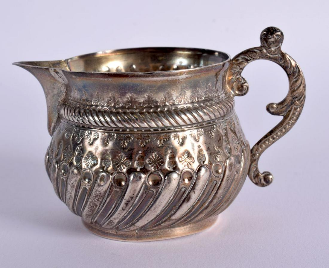 AN EMBOSSED STERLING SILVER CREAM JUG BY CHARLES STUART HARRS. Hallmarked London 1886, 6.7cm x 10cm: AN EMBOSSED STERLING SILVER CREAM JUG BY CHARLES STUART HARRS. Hallmarked London 1886, 6.7cm x 10cm x 7cm, weight 76g