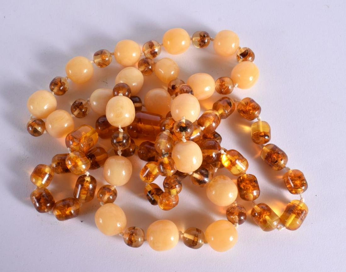 TWO BAKELITE AMBER COLOURED NECKLACES.  Longest 74cm, total weight 202g (2) (1 of 2)