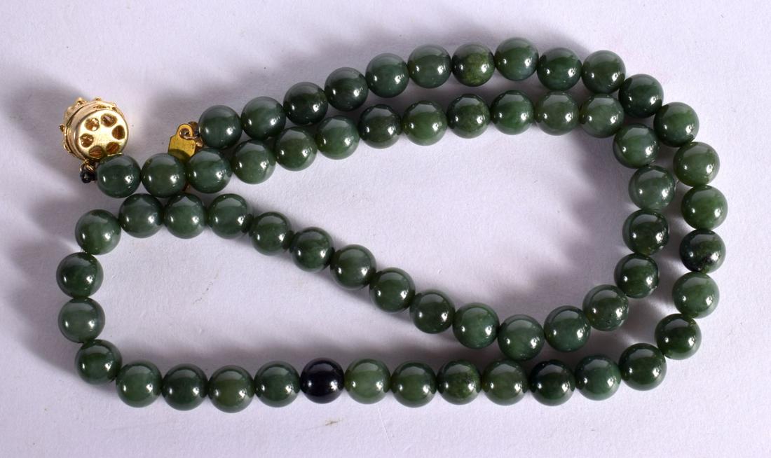 A VINTAGE JADE NECKLACE. 53 grams. 50 cm long. (1 of 2)