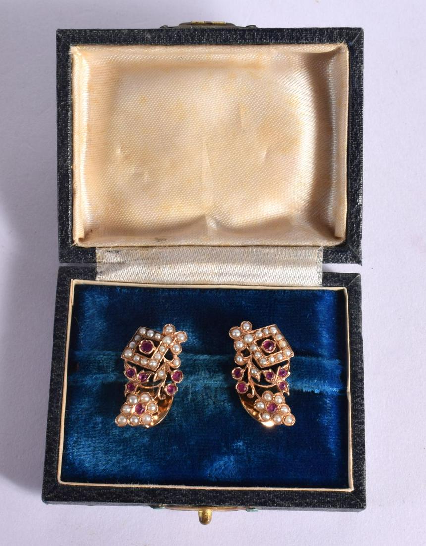 A PAIR OF MIDDLE EASTERN ISLAMIC YELLOW METAL EARRINGS. 9 grams. 2.75 cm x 6 cm. (1 of 2)
