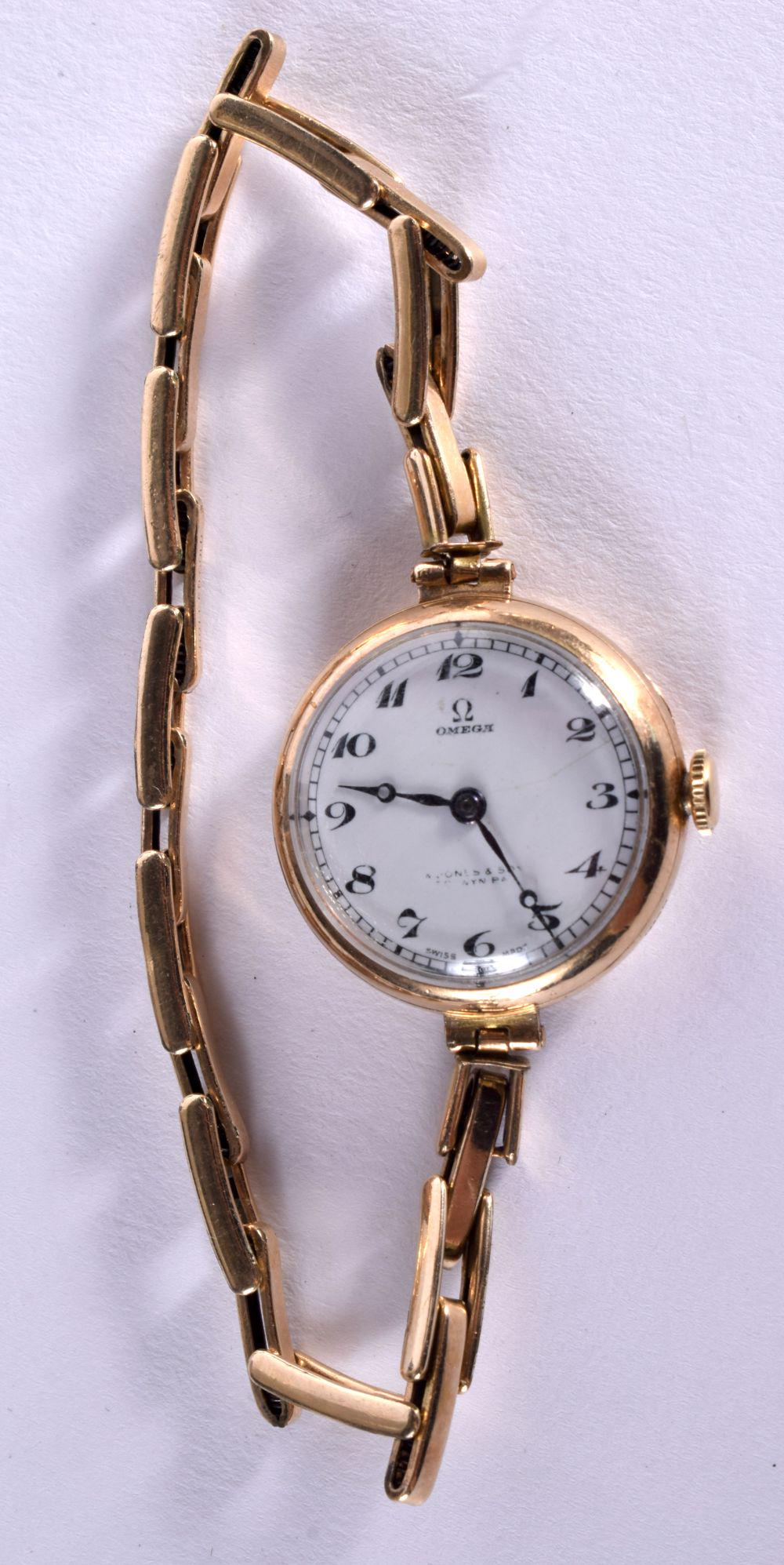 A 9CT GOLD LADIES OMEGA WATCH.  Dial 2.7cm (incl crown), weight 21g (1 of 2)