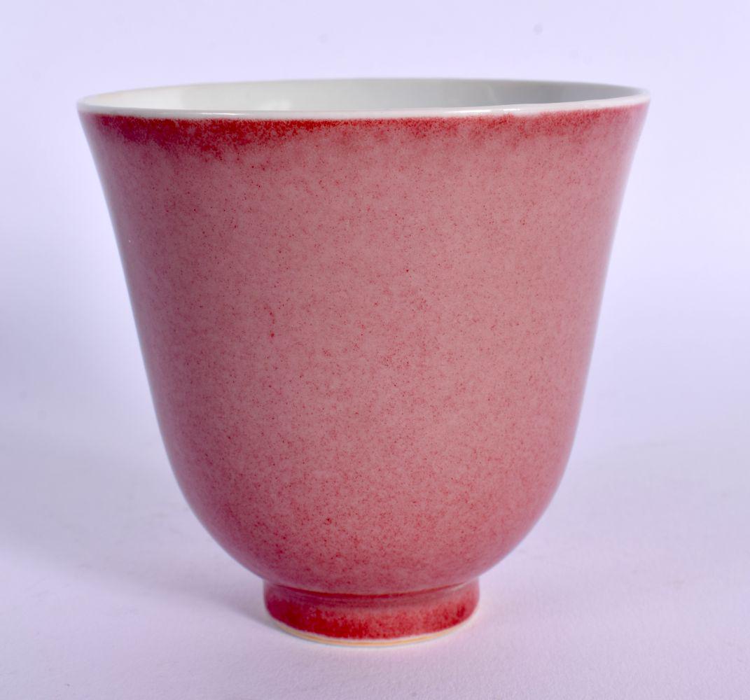 A CHINESE PEACH BLOOM GROUND PORCELAIN WINE CUP 20th Century, bearing Daoguang marks to base. 8.5 cm: A CHINESE PEACH BLOOM GROUND PORCELAIN WINE CUP 20th Century, bearing Daoguang marks to base. 8.5 cm high.