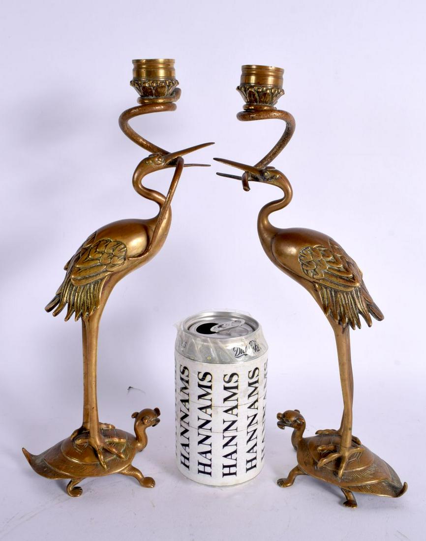 A PAIR OF 19TH CENTURY JAPANESE MEIJI PERIOD BRONZE CANDLESTICKS formed as birds. 31 cm high. (1 of 3)