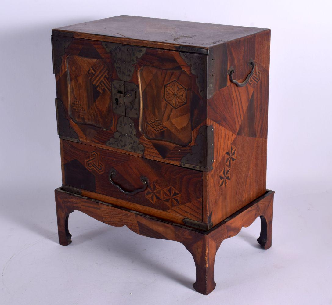 A 19TH CENTURY JAPANESE MEIJI PERIOD PARQUETRY MIXED WOOD TABLE CABINET decorated with motifs. 32 cm (1 of 3)