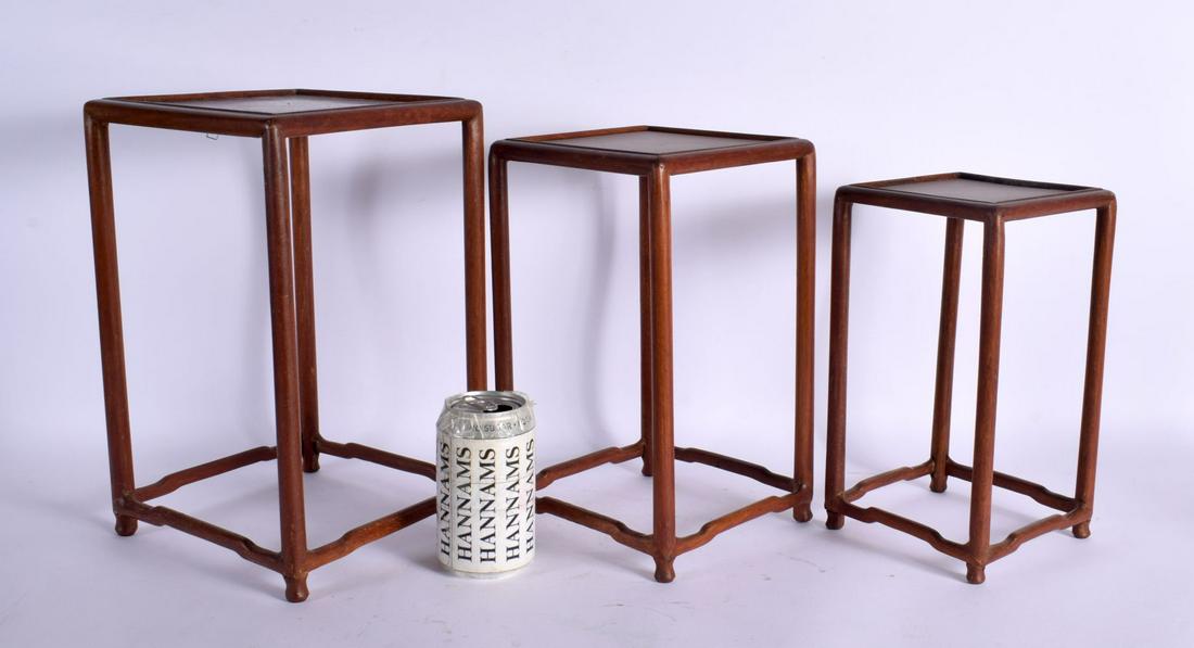 A NEST OF THREE EARLY 20TH CENTURY CHINESE HARDWOOD STANDS Late Qing/Republic. Largest 32 cm x 16 cm: A NEST OF THREE EARLY 20TH CENTURY CHINESE HARDWOOD STANDS Late Qing/Republic. Largest 32 cm x 16 cm. (3)