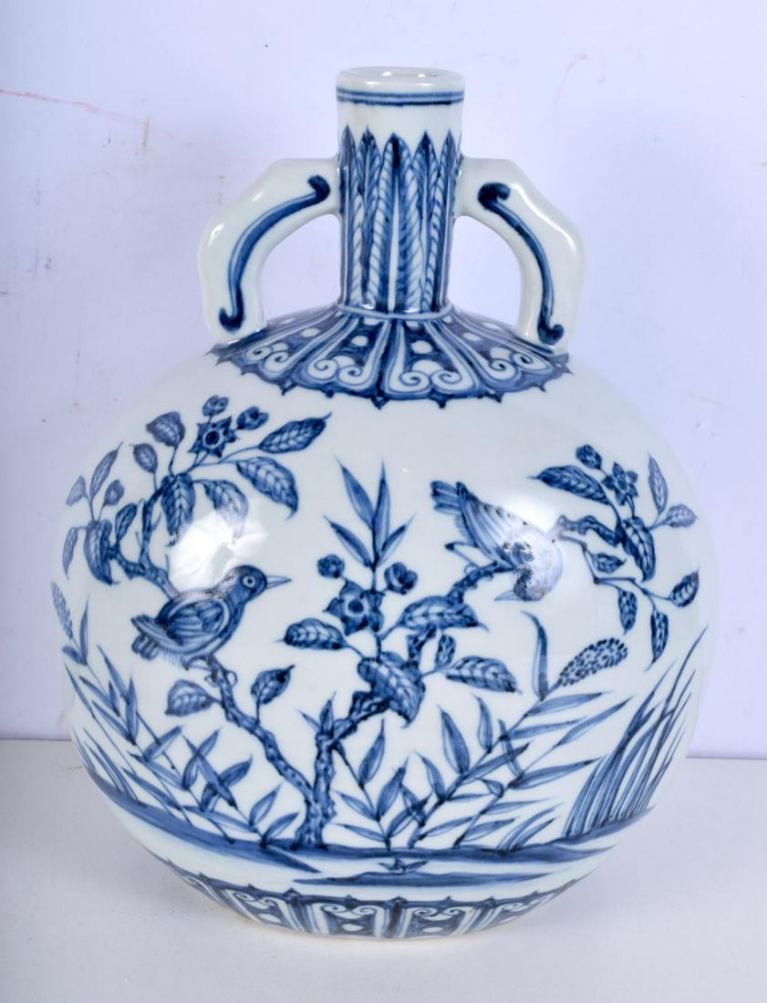 A Chinese Porcelain blue and white Moon flask decorated with birds and flowers 28cm.: A Chinese Porcelain blue and white Moon flask decorated with birds and flowers 28cm.