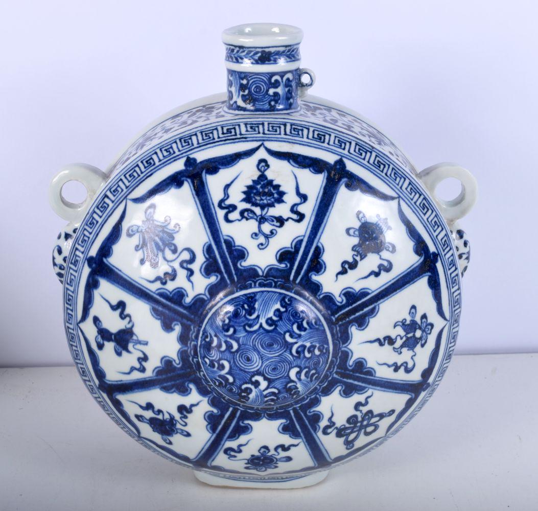 A large Chinese Porcelain blue and white moon flask decorated  with flower patterns in panels 29 cm. (1 of 5)