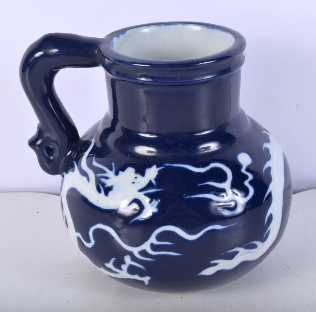 A Chinese Porcelain Sacrificial blue jug decorated  in relief a dragon 14 x 16  cm. (1 of 6)
