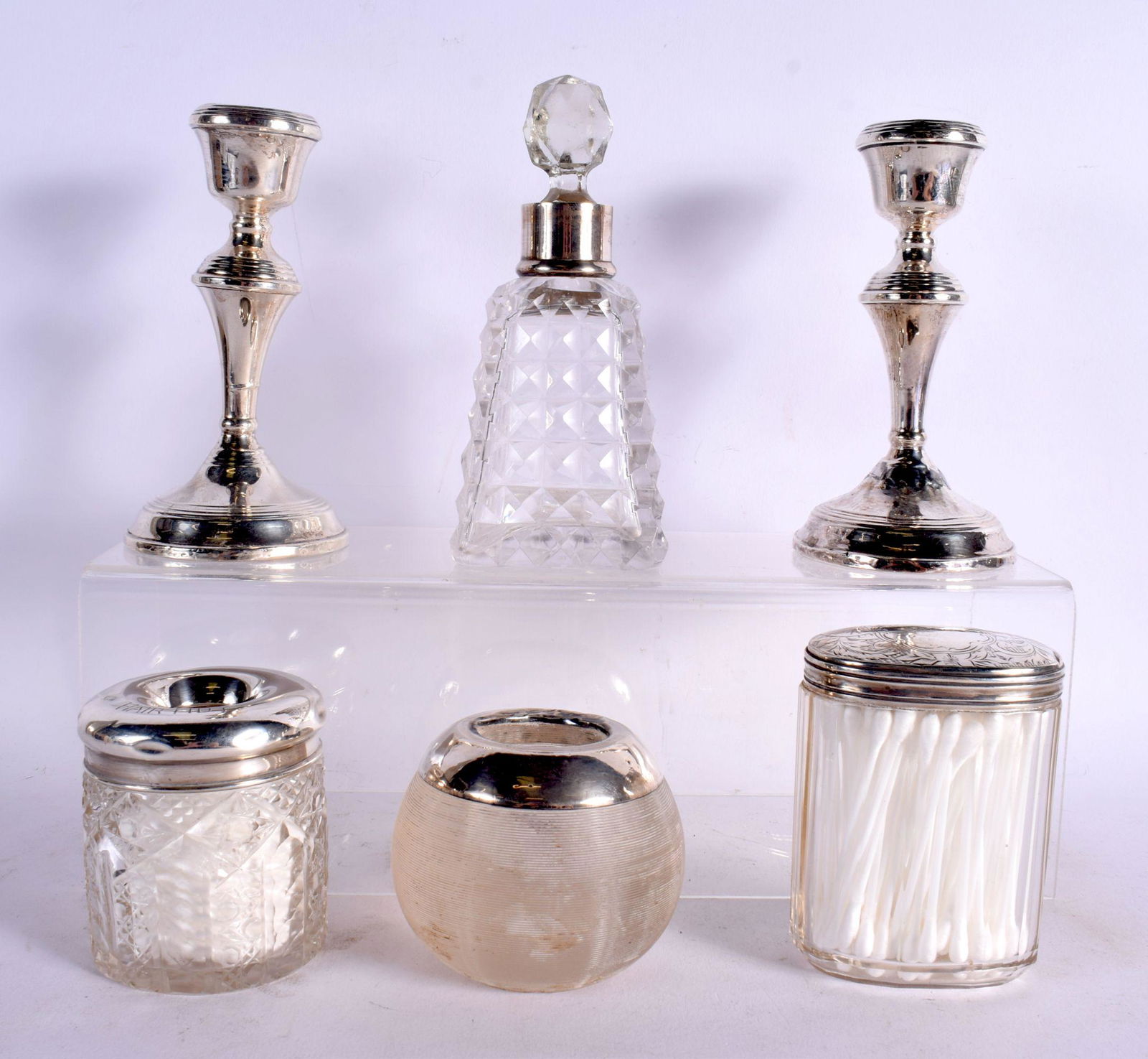 THREE ANTIQUE SILVER TOPPED JARS together with a silver mounted scent bottle & a pair of silver cand (1 of 11)