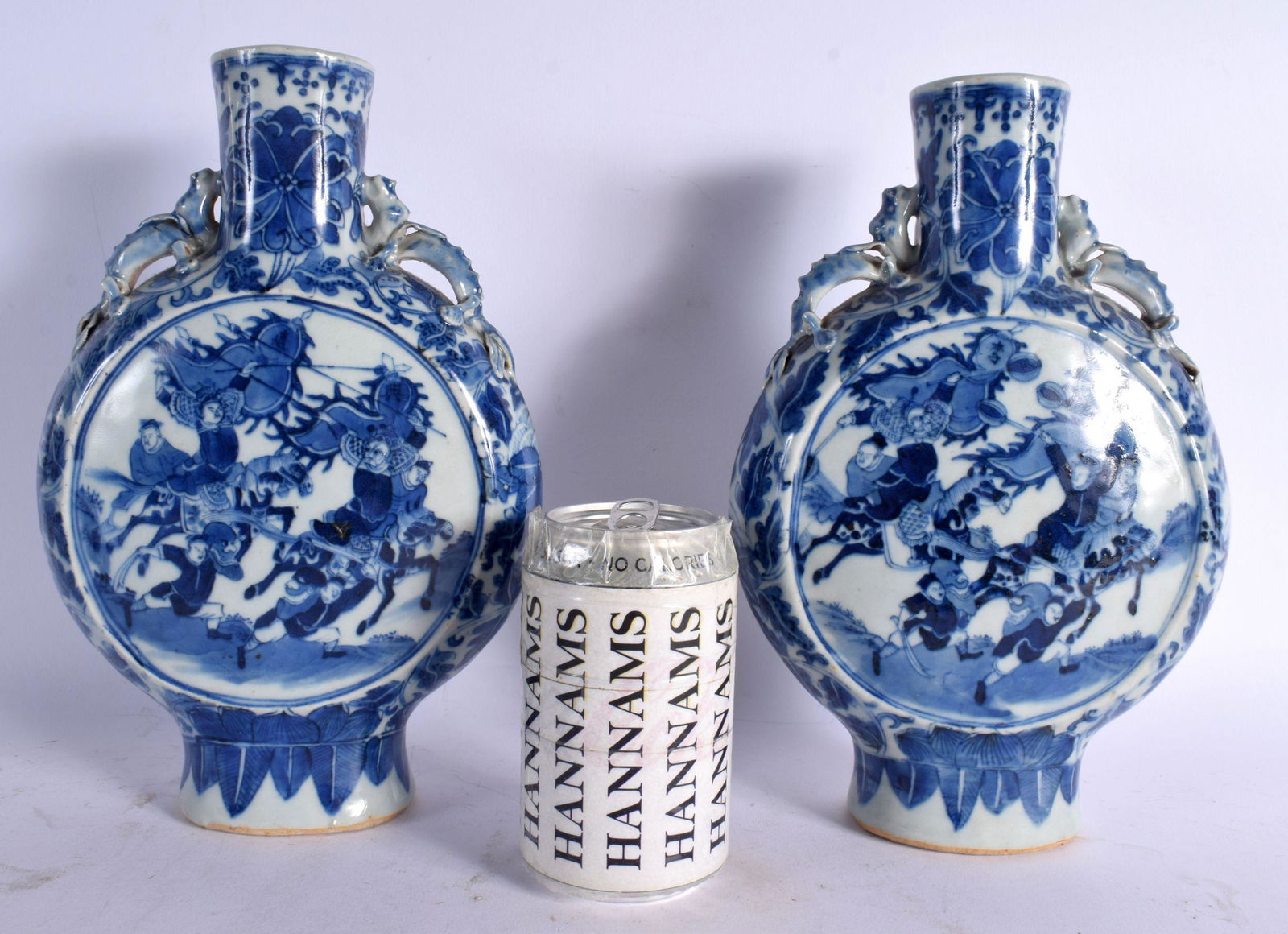 A PAIR OF MID 19TH CENTURY CHINESE BLUE AND WHITE PORCELAIN PILGRIM FLASKS Qing, painted with figure: A PAIR OF MID 19TH CENTURY CHINESE BLUE AND WHITE PORCELAIN PILGRIM FLASKS Qing, painted with figures in landscapes. 27 cm x 15 cm.