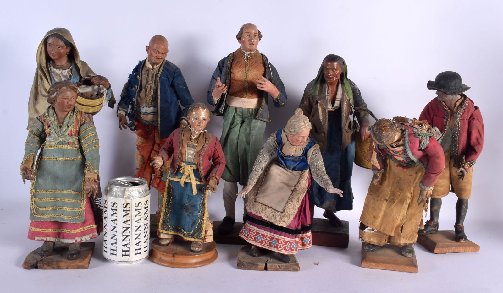 A SET OF NINE 19TH CENTURY ITALIAN PAINTED WOOD FIGURES modelled in silk outfits, upon wooden plinth (1 of 13)