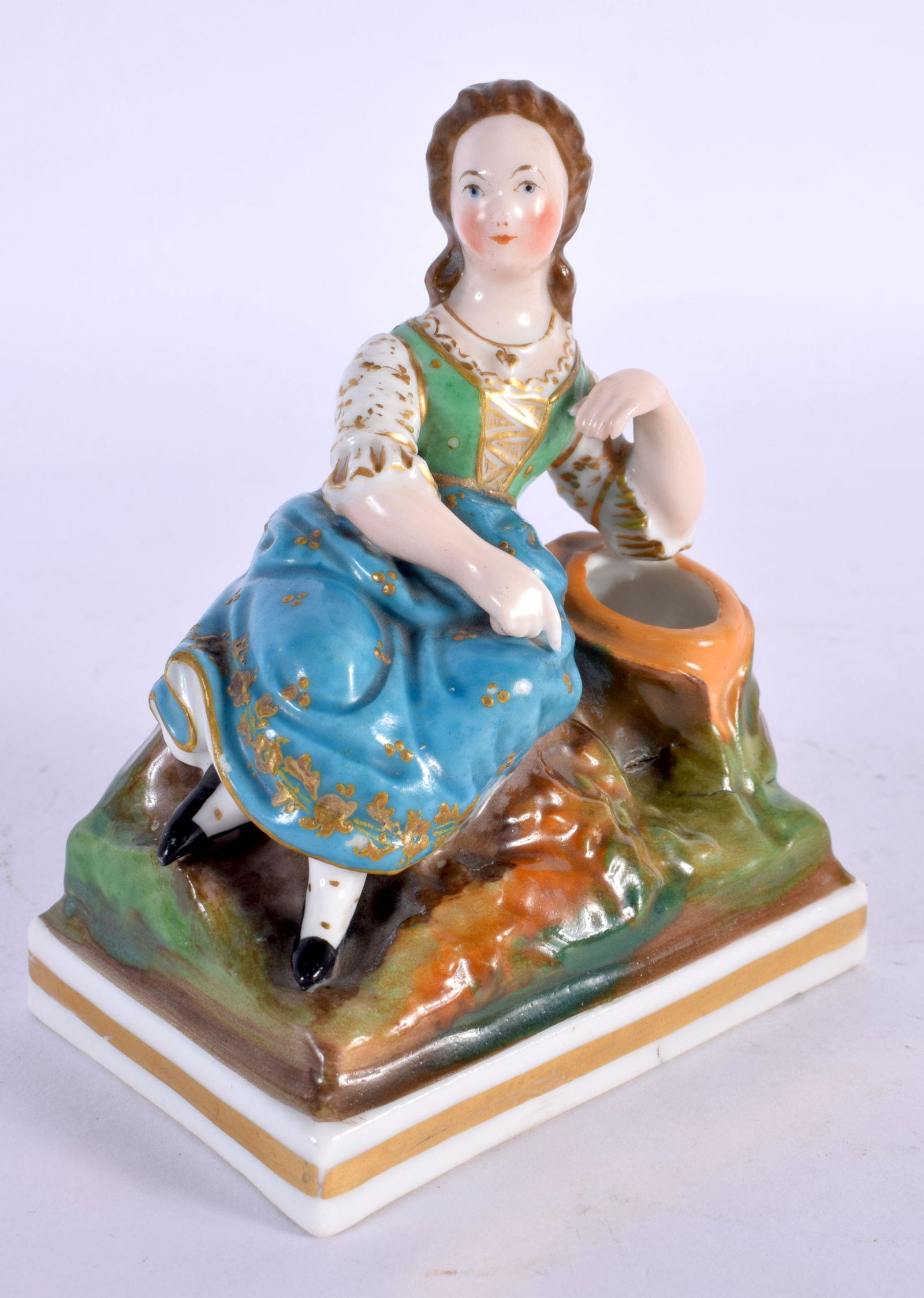A 19TH CENTURY CONTINENTAL PORCELAIN FIGURE OF A FEMALE probably French or Russian. 8 cm x 10 cm. (1 of 4)