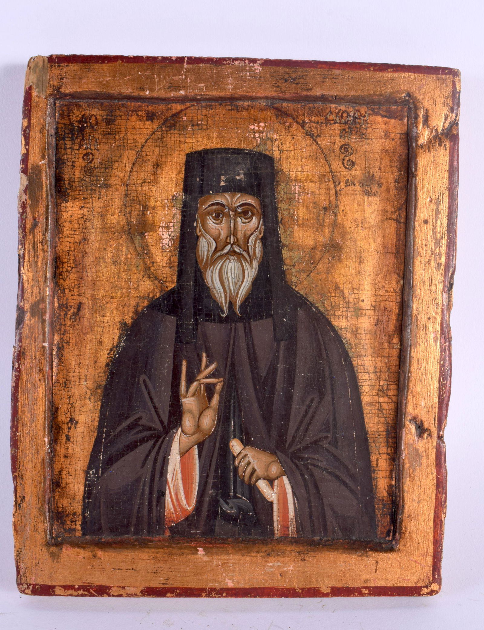 AN ANTIQUE RUSSIAN POLYCHROMED WOOD ICON. 23 cm x 18 cm. (1 of 4)