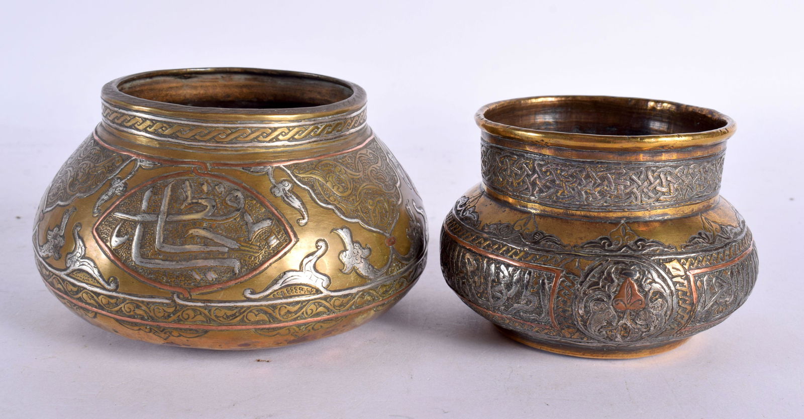 TWO 19TH CENTURY MIDDLE EASTERN SILVER INLAID CENSERS decorated with calligraphy. Largest 11 cm wide (1 of 5)
