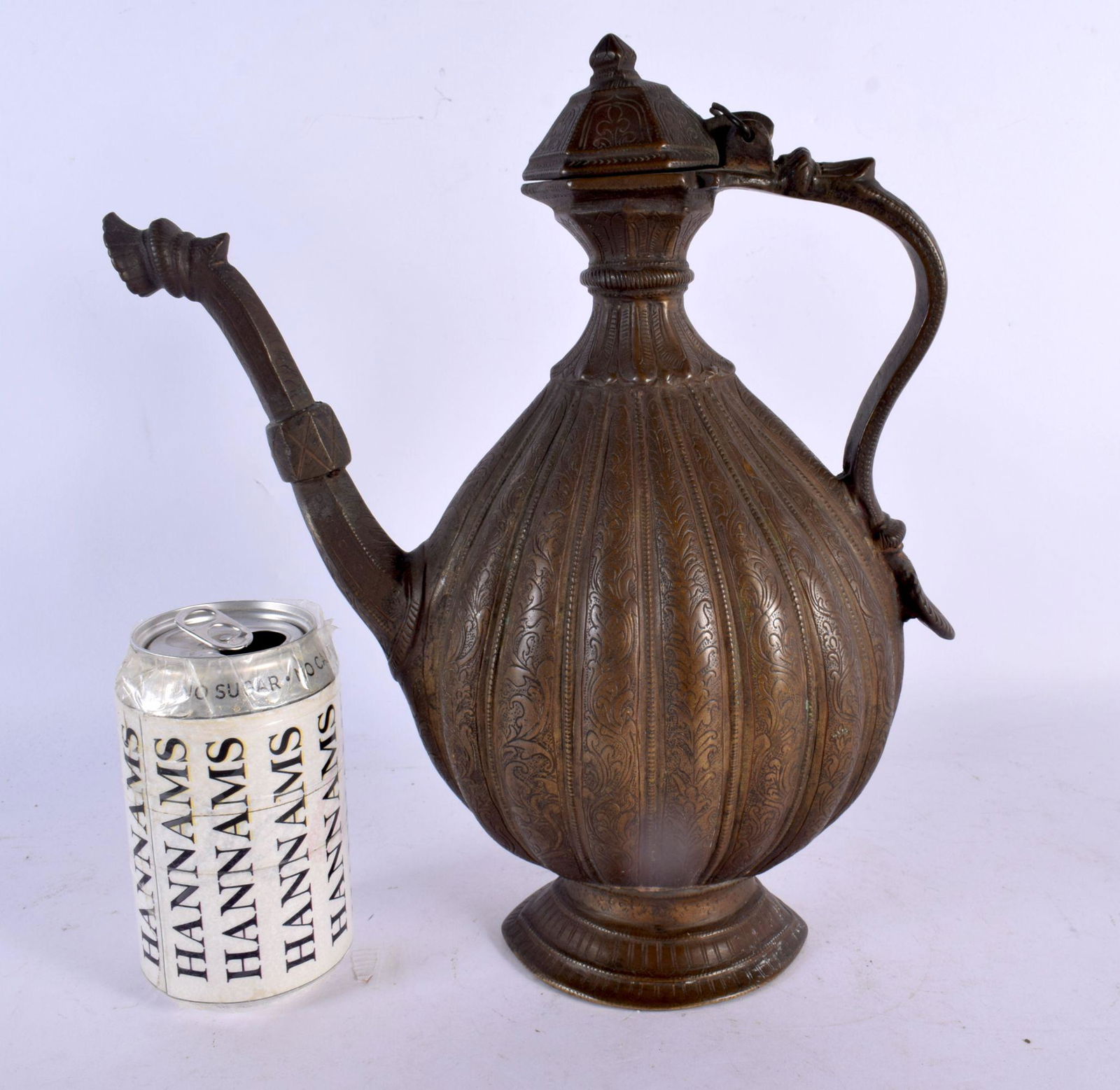 A LARGE 17TH/18TH CENTURY MIDDLE EASTERN MIXED ALLOY JUG decorated all over with foliage and vines. (1 of 6)