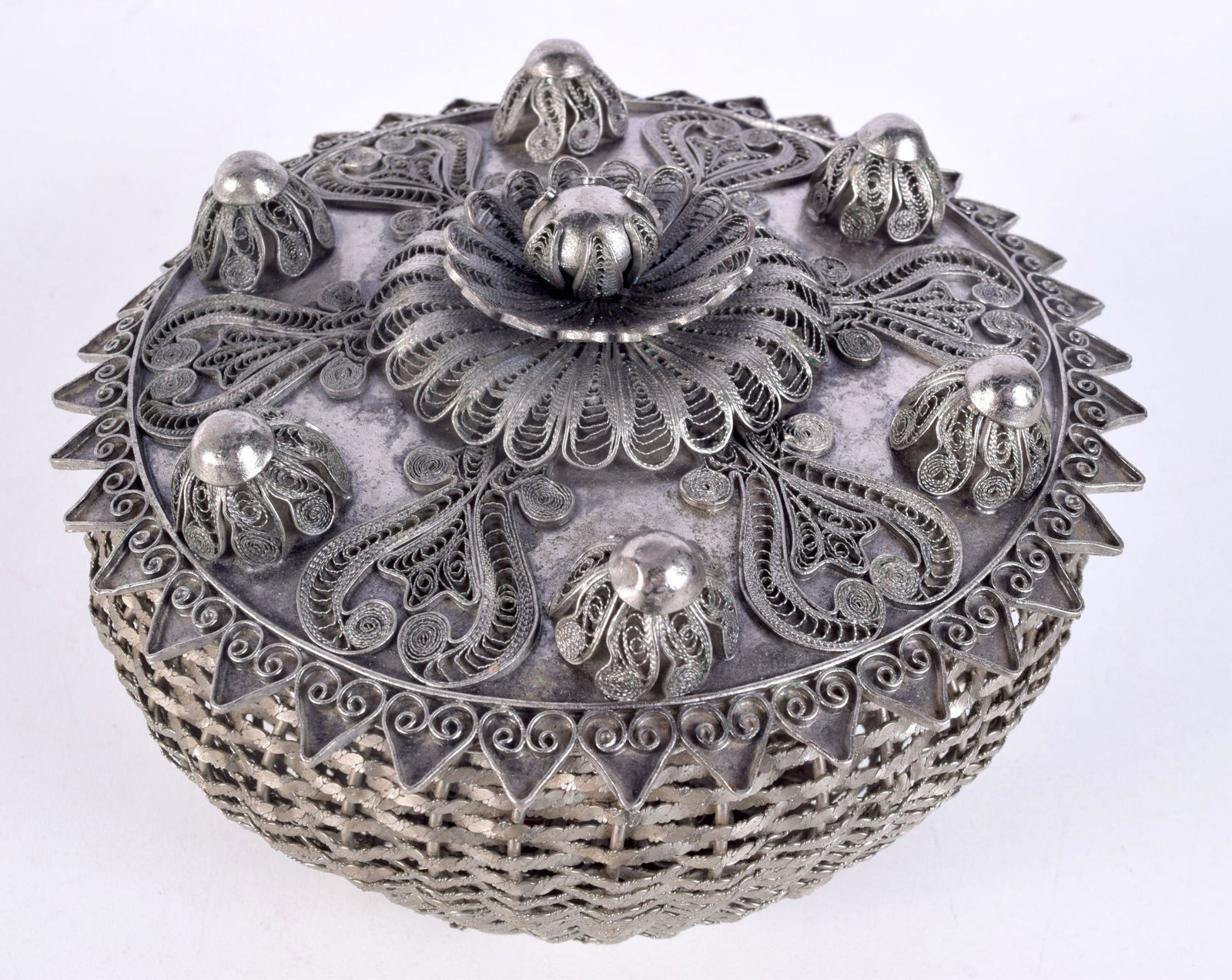 AN UNUSUAL EARLY 20TH CENTURY MIDDLE EASTERN WHITE METAL FILIGREE COVER upon an Albanian basket. 690 (1 of 4)